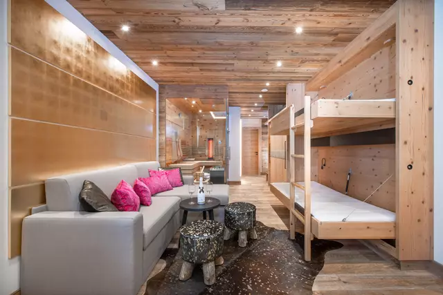 Couch with table and folded-out bunk bed