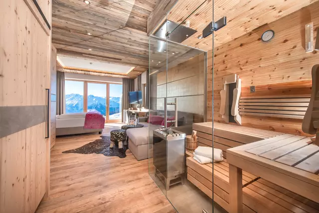 Finnish sauna in the room, room and couch in the background