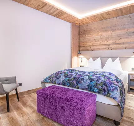 Box spring bed with chair and details